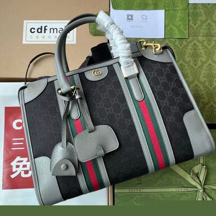 G*u*i top handle bags